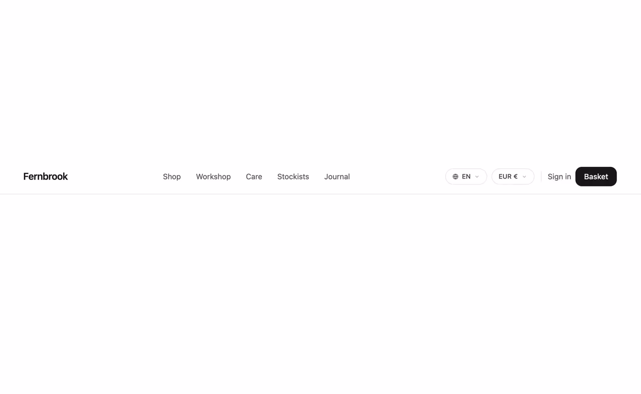 Rendered preview — Nav with currency and language